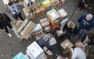 Volunteers prepare to load a van with donations for Ukrainian refugees, photo via PA.