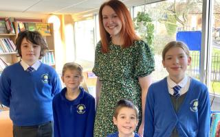 GOOD: Karen Crawford, headteacher, and pupils from Clifton-upon-Teme Primary School