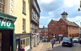 11 High Street, currently pale yellow, lies in the heart of the Ross-on-Wye conservation area
