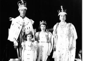King George VI during his coronation in 1936, with Queen Elizabeth and Princesses Margaret and Elizabeth