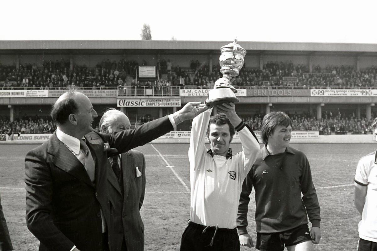 Hereford United Manager John Sillett & Captain Terry Paine lift the division three championship trophy aloft in 1976.