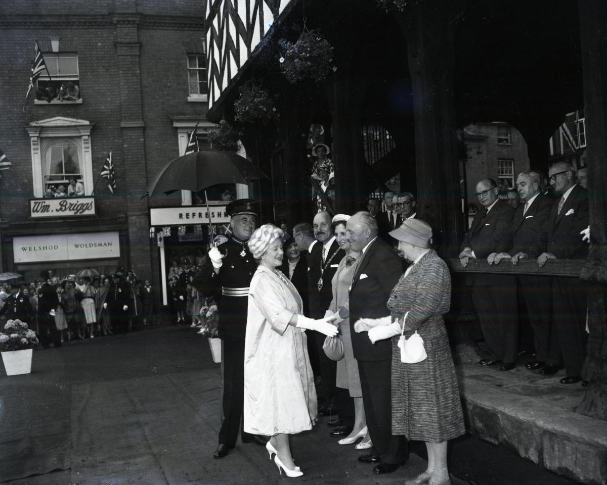 The Queen Mother on a visit to Ledbury, pictured here being greeted by people at the Market House. (date unknown)