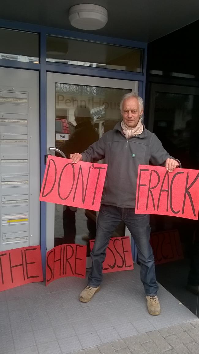 Greenpeace campaigner Rick Guest outside Jesse Norman's office.