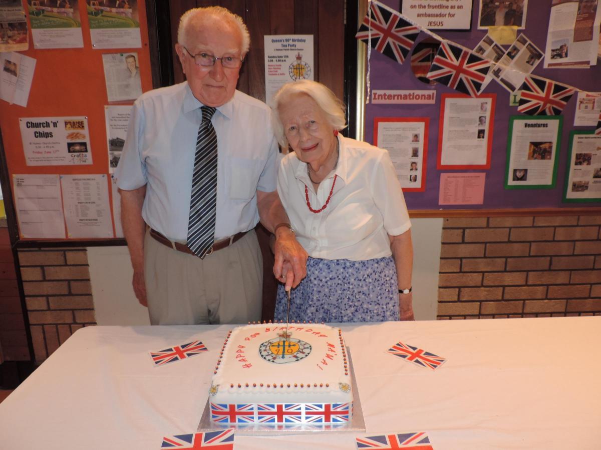 Holmer Church celebrated the with a tea party for 150 in the church centre. The traditional Royal  birthday cake was cut by Mari Nicholas and Ron Jenkins, who  will shortly  be celebrating their own 90th birthdays