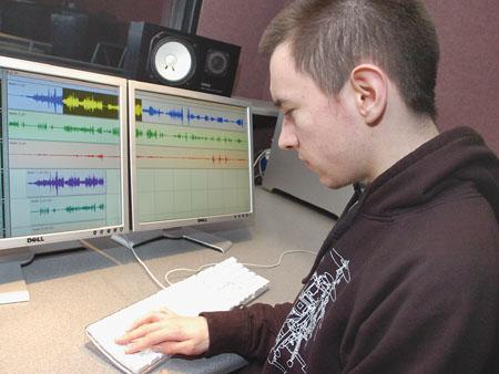Trahern Culver editing audio using multitrack recording software.
